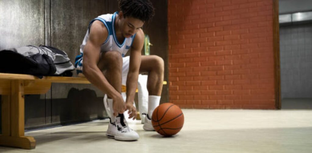 Why do basketball players wipe their shoes?